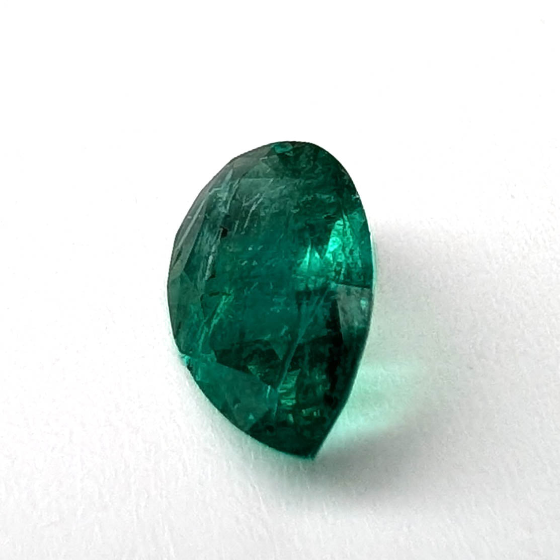 Emerald faceted pear cut gemstone, 0.94ct, alternate angle, view 3 of 10