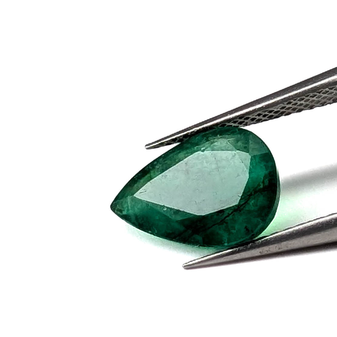 Emerald faceted pear cut gemstone, 2.80ct, held in tweezers, view 2 of 13
