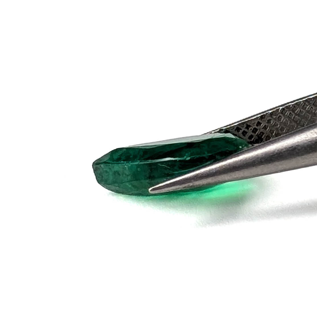 Emerald faceted pear cut gemstone, 2.80ct, held in tweezers, view 13 of 13