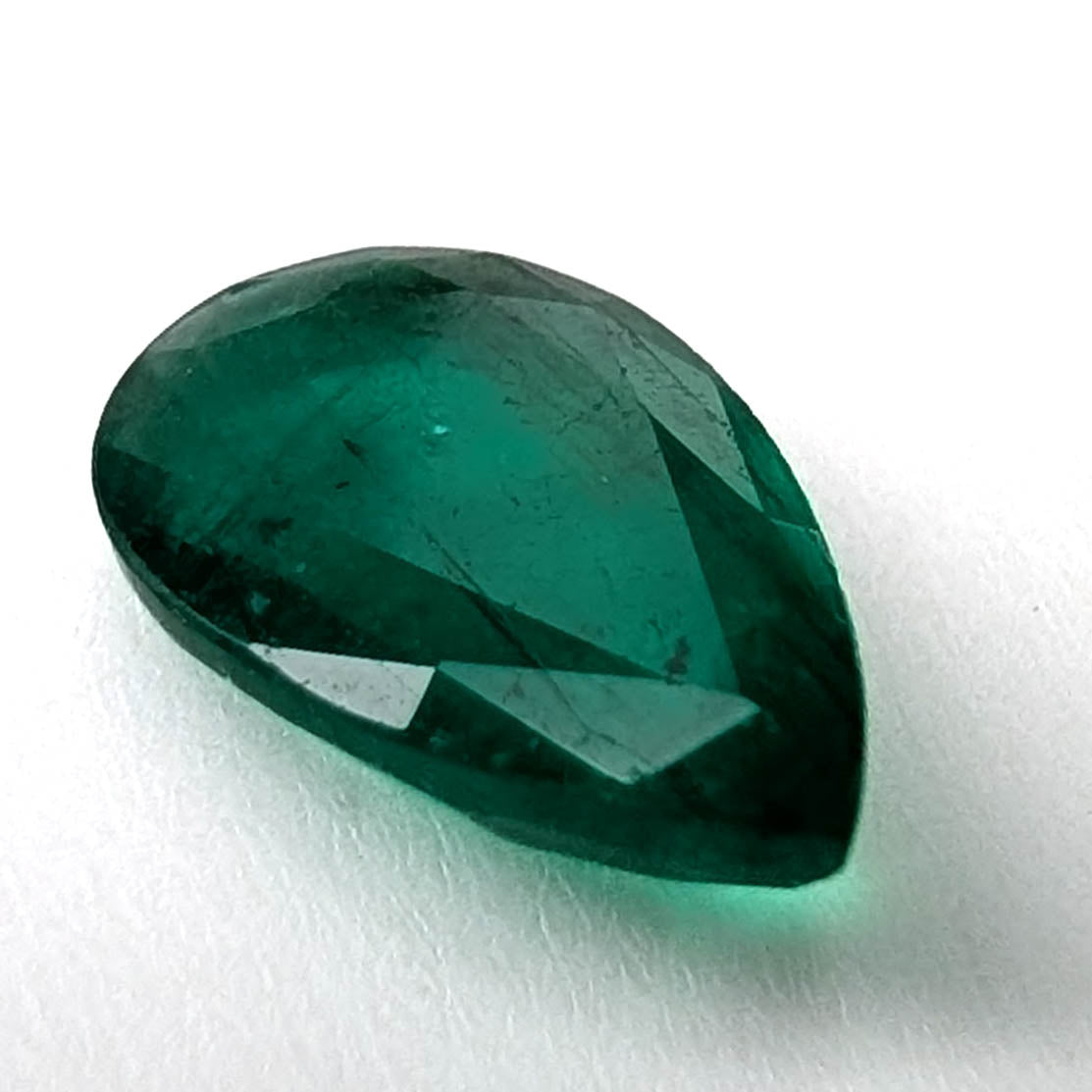 Emerald faceted pear gemstone, 1.60ct, angled view of the crown facets, view 3 of 11