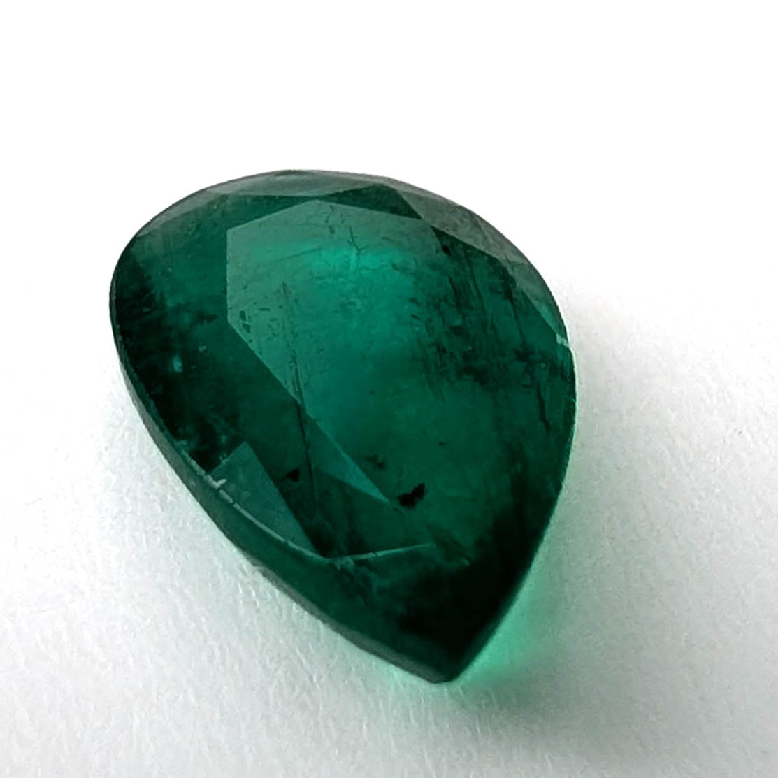 Emerald faceted pear gemstone, 1.60ct, view from the point, view 4 of 11