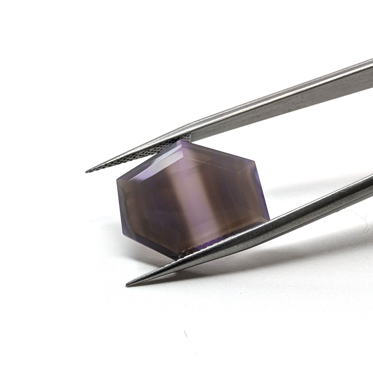 Holly Blue agate faceted freeform step tablet cut gemstone, 9.65ct, from Holley, Oregon, held in tweezers, view 2 of 9