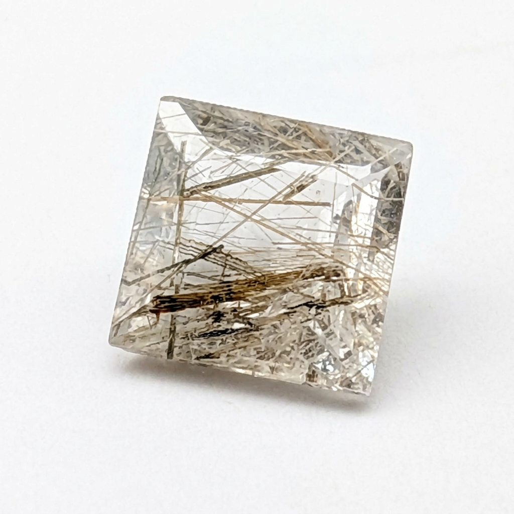 Actinolite quartz faceted square gemstone, 1.85ct, from Mount Breakenridge, Harrison Lake, BC, Canada, on a white background, view 1 of 10