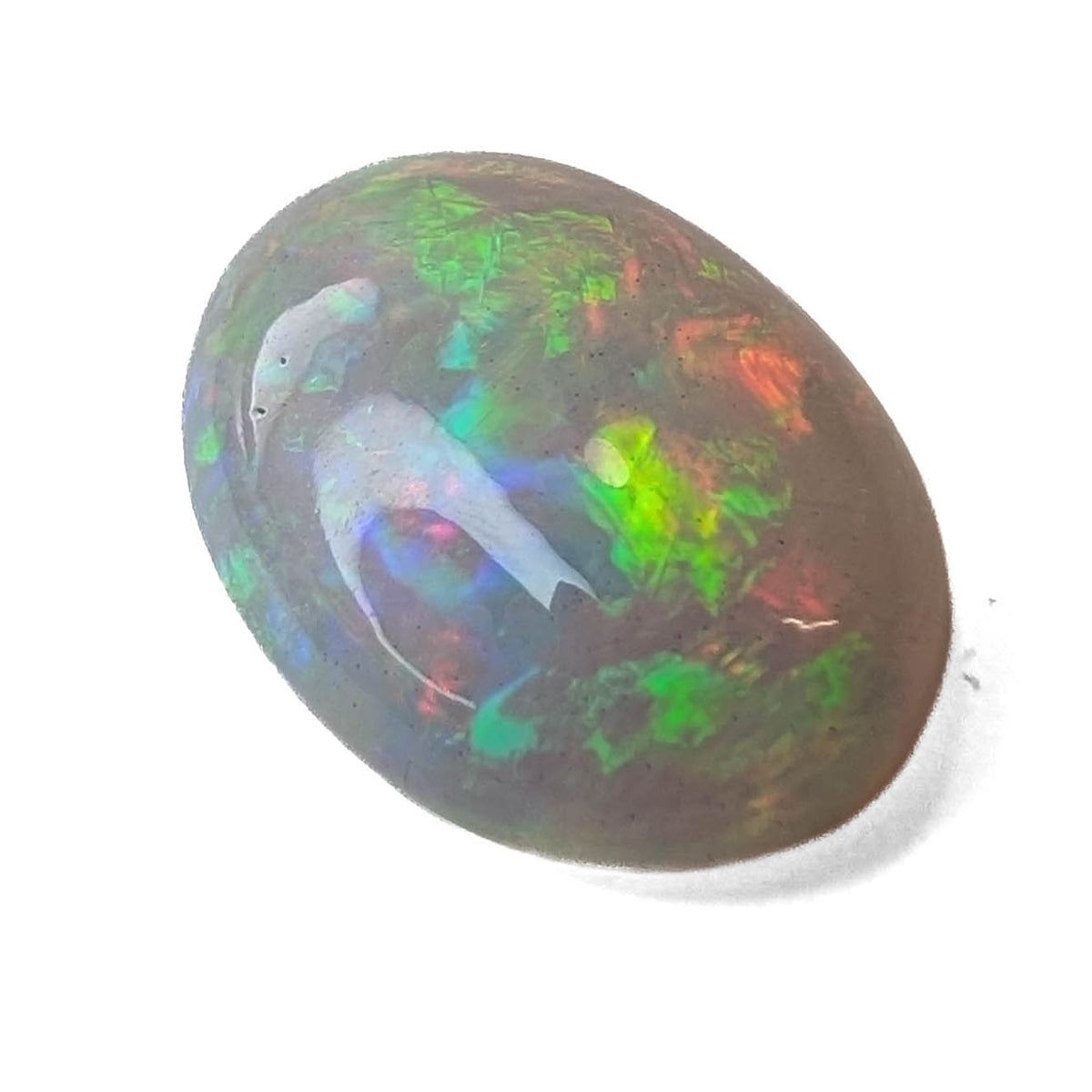 Ethiopian solid opal cabochon oval gemstone, 10.07ct, on a white background, view 1 of 8