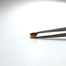 Oregon fire opal faceted round fantasy cut gemstone, 1.82ct, held in tweezers, view 11 of 11