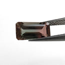 Oregon Sunstone faceted emerald cut gemstone, 2.39ct, from Plush, Oregon, held in tweezers, view 2 of 11