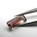 Oregon sunstone faceted emerald gemstone, 3.18ct, held in tweezers, view 9 of 9