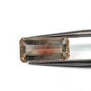 Oregon sunstone faceted emerald gemstone, 3.60ct, held in tweezers, view 7 of 7