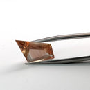 Oregon Sunstone faceted freeform step cut gemstone, 5.50ct, from Plush, Oregon, held in tweezers, view 2 of 8