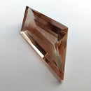 Oregon Sunstone faceted freeform step cut gemstone, 5.50ct, from Plush, Oregon, on a white background, view 6 of 8