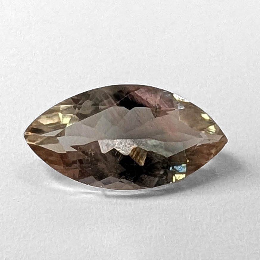 Oregon Sunstone faceted marquise cut gemstone, 1.49ct, from Plush, Oregon, on a white background, view 1 of 8