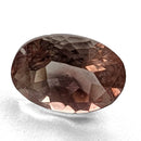 Oregon Sunstone faceted oval cut gemstone, 0.91ct, from Plush, Oregon, on a white background, view 1 of 11