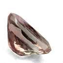 Oregon Sunstone faceted oval cut gemstone, 0.91ct, from Plush, Oregon, on a white background, view 8 of 11