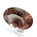 Oregon Sunstone faceted oval cut gemstone, 0.91ct, from Plush, Oregon, on a white background, view 11 of 11