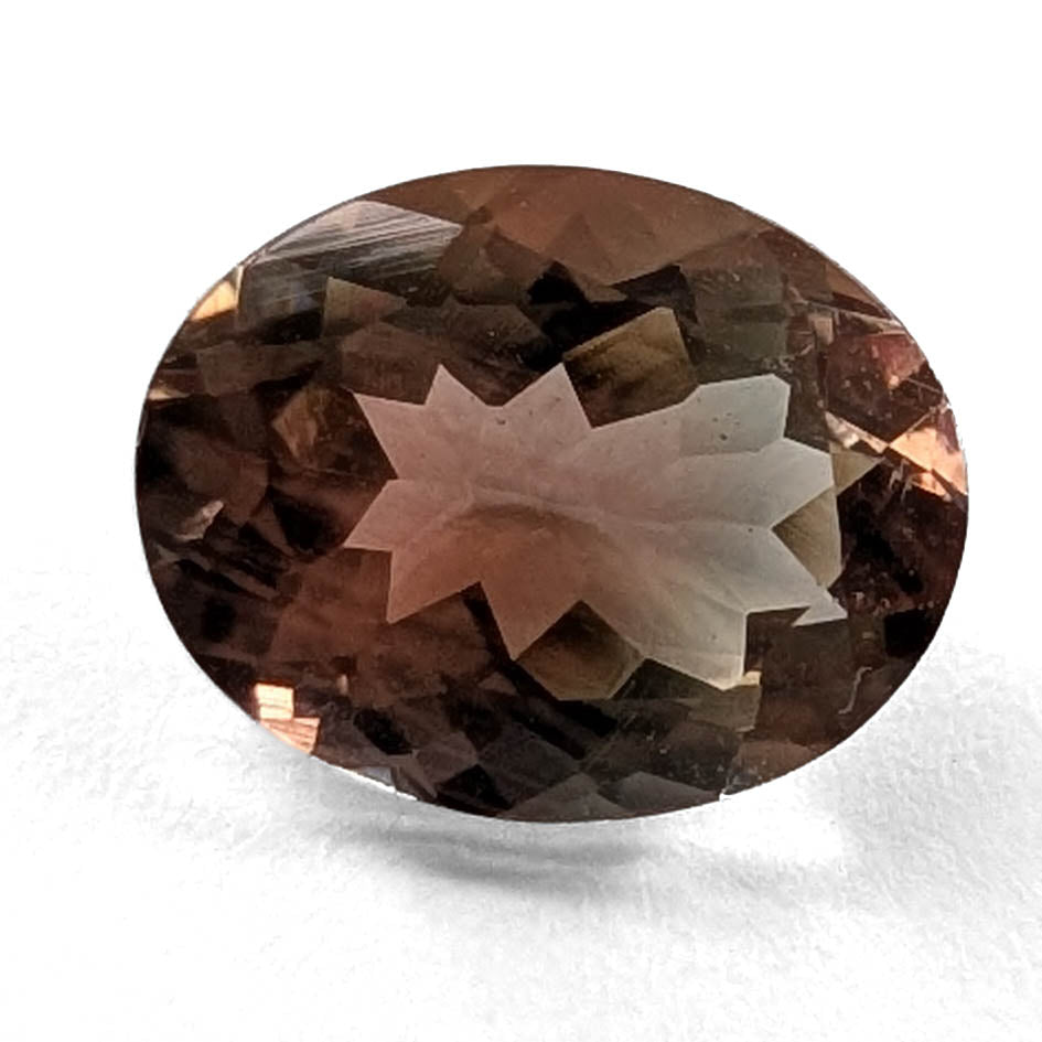 Oregon Sunstone faceted oval cut gemstone, 1.81ct, from Plush, Oregon, on a white background, view 1 of 11