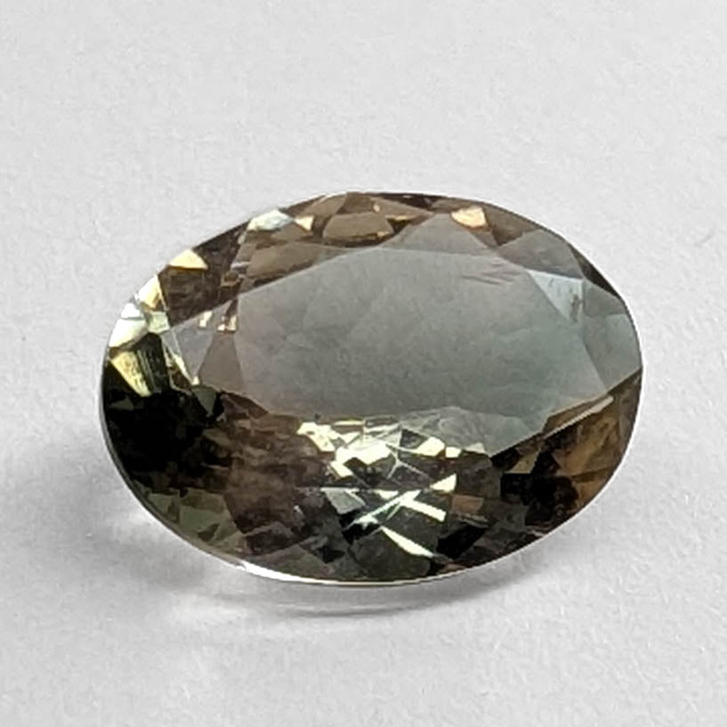 Oregon Sunstone faceted oval cut gemstone, 1.89ct, from Plush, Oregon, on a white background, view 1 of 10