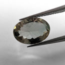 Oregon Sunstone faceted oval cut gemstone, 1.89ct, from Plush, Oregon, held in tweezers, view 2 of 10