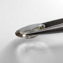 Oregon Sunstone faceted oval cut gemstone, 1.89ct, from Plush, Oregon, held in tweezers, view 3 of 10
