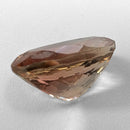 Oregon Sunstone faceted oval cut gemstone, 5.57ct, from Plush, Oregon, on a white background, view 8 of 11