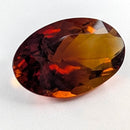Oregon Sunstone faceted oval cut gemstone, 8.00ct, from Plush, Oregon, on a white background, view 1 of 8
