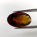 Oregon Sunstone faceted oval cut gemstone, 8.00ct, from Plush, Oregon, held in tweezers, view 2 of 8