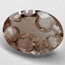 Oregon Sunstone faceted oval fantasy cut gemstone, 2.20ct, from Plush, Oregon, on a white background, view 1 of 11