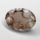 Oregon Sunstone faceted oval fantasy cut gemstone, 2.20ct, from Plush, Oregon, on a white background, view 5 of 11