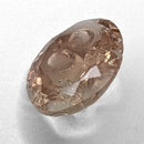 Oregon Sunstone faceted oval fantasy cut gemstone, 2.20ct, from Plush, Oregon, on a white background, view 7 of 11