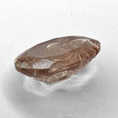 Oregon Sunstone faceted oval fantasy cut gemstone, 2.20ct, from Plush, Oregon, on a white background, view 8 of 11