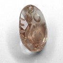 Oregon Sunstone faceted oval fantasy cut gemstone, 2.20ct, from Plush, Oregon, on a white background, view 10 of 11