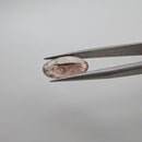 Oregon Sunstone faceted oval fantasy cut gemstone, 3.11ct, from Plush, Oregon, held in tweezers, view 3 of 15