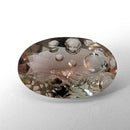 Oregon Sunstone faceted oval fantasy cut gemstone, 3.11ct, from Plush, Oregon, on a white background, view 4 of 15