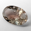 Oregon Sunstone faceted oval fantasy cut gemstone, 3.11ct, from Plush, Oregon, on a white background, view 5 of 15