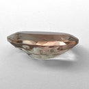 Oregon Sunstone faceted oval fantasy cut gemstone, 3.11ct, from Plush, Oregon, on a white background, view 10 of 15