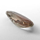 Oregon Sunstone faceted oval fantasy cut gemstone, 3.11ct, from Plush, Oregon, on a white background, view 11 of 15
