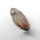 Oregon Sunstone faceted oval fantasy cut gemstone, 3.11ct, from Plush, Oregon, on a white background, view 12 of 15