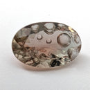 Oregon Sunstone faceted oval fantasy cut gemstone, 3.11ct, from Plush, Oregon, on a white background, view 15 of 15