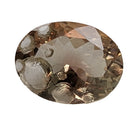 Oregon Sunstone faceted oval fantasy cut gemstone, 4.31ct, from Plush, Oregon, on a white background, view 1 of 10