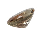 Oregon Sunstone faceted oval fantasy cut gemstone, 4.31ct, from Plush, Oregon, on a white background, view 5 of 10