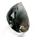 Oregon Sunstone faceted pear cut gemstone, 0.59ct, from Plush, Oregon, on a white background, view 4 of 8