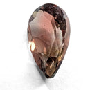 Oregon Sunstone faceted pear cut gemstone, 0.84ct, from Plush, Oregon, on a white background, view 4 of 9