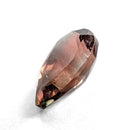 Oregon Sunstone faceted pear cut gemstone, 0.84ct, from Plush, Oregon, on a white background, view 5 of 9