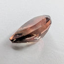 Oregon Sunstone faceted pear cut gemstone, 0.84ct, from Plush, Oregon, on a white background, view 6 of 9