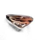 Oregon Sunstone faceted pear cut gemstone, 0.84ct, from Plush, Oregon, on a white background, view 7 of 9