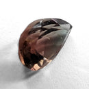 Oregon Sunstone faceted pear cut gemstone, 0.84ct, from Plush, Oregon, on a white background, view 8 of 9