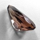 Oregon Sunstone faceted pear cut gemstone, 0.84ct, from Plush, Oregon, on a white background, view 9 of 9