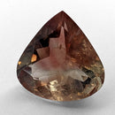 Oregon Sunstone faceted pear cut gemstone, 5.21ct, from Plush, Oregon, on a white background, view 1 of 12