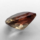 Oregon Sunstone faceted pear cut gemstone, 5.21ct, from Plush, Oregon, on a white background, view 8 of 12