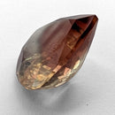 Oregon Sunstone faceted pear cut gemstone, 5.21ct, from Plush, Oregon, on a white background, view 9 of 12