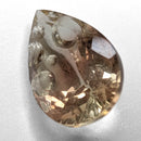 Oregon Sunstone faceted pear fantasy cut gemstone, 3.76ct, from Plush, Oregon, on a white background, view 10 of 11